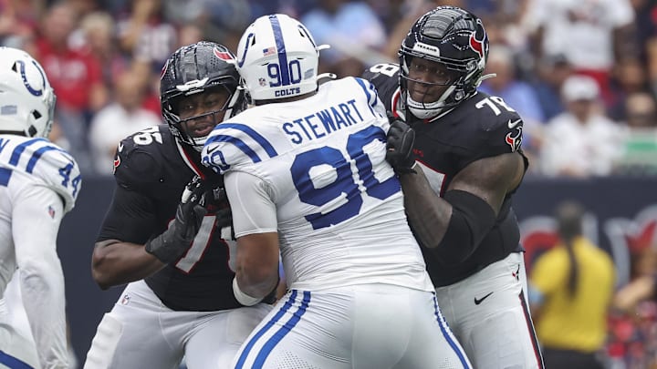 Houston Texans guard Kenyon Green (76) and offensive tackle Laremy Tunsil (78) attempt to block