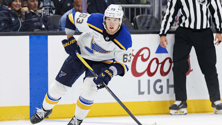 Oct 8, 2024; Seattle, Washington, USA; St. Louis Blues left wing Jake Neighbours (63) skates against the Seattle Kraken during the second period at Climate Pledge Arena. Mandatory Credit: Caean Couto-Imagn Images