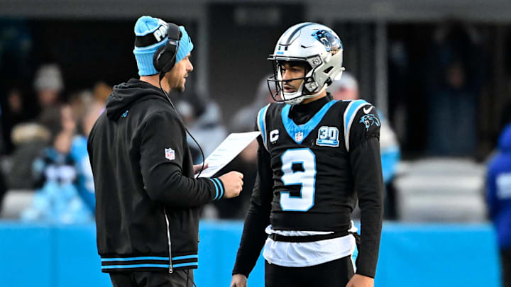 Dec 22, 2024; Charlotte, North Carolina, USA; Carolina Panthers head coach Dave Canales with quarterback Bryce Young (9) in the fourth quarter at Bank of America Stadium. Mandatory Credit: Bob Donnan-Imagn Images