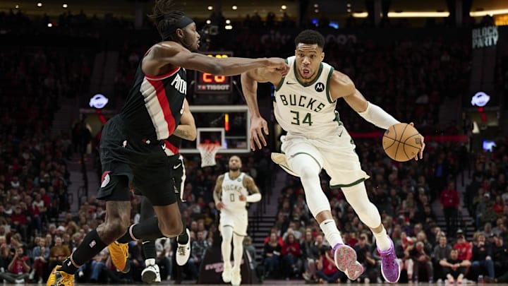 Jan 31, 2024; Portland, Oregon, USA; Milwaukee Bucks forward Giannis Antetokounmpo (34) drives to the basket during the first half against Portland Trail Blazers forward Jerami Grant (9) at Moda Center. Mandatory Credit: Troy Wayrynen-Imagn Images