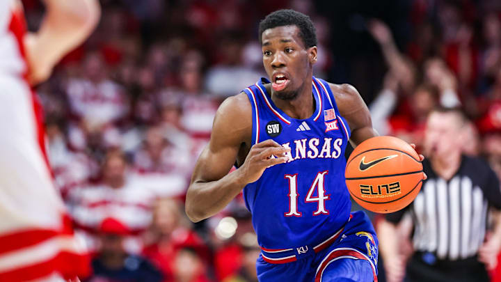 Feb 28, 2026; Tucson, Arizona, USA; Kansas Jayhawks guard Melvin Council Jr. (14) dribbles the ball during the first half of the game against the Arizona Wildcats at McKale Memorial Center. Mandatory Credit: Aryanna Frank-Imagn Images
