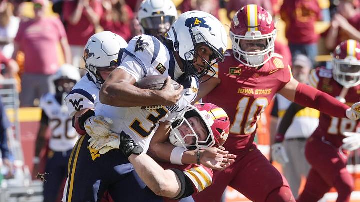 Iowa State linebacker Sullivan Schlimgen (7) takes down West Virginia quarterback Michael Hawkins Jr. (3) during the fourth quarter in a Big 12 Conference football game on Oct. 3, 2026, at Jack Trice Stadium in Ames. Iowa State linebacker Sullivan Schlimgen (7) takes down West Virginia quarterback Michael Hawkins Jr. (3) during the fourth quarter in a Big 12 Conference football game on Oct. 3, 2026, at Jack Trice Stadium in Ames.