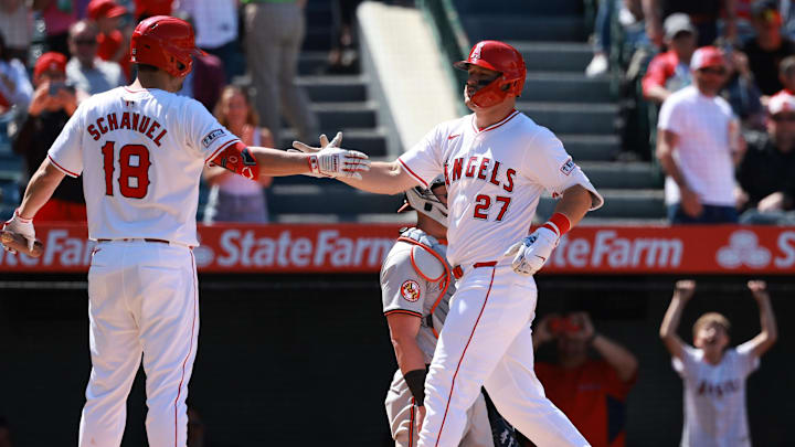 Apr 24, 2024; Anaheim, California, USA;  Los Angeles Angels designated hitter Mike Trout (27) is greeted by first base Nolan Schanuel (18) after hitting a home run during the sixth inning against the Baltimore Orioles at Angel Stadium. Mandatory Credit: Kiyoshi Mio-Imagn Images