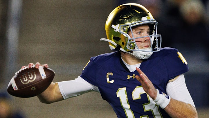 Notre Dame quarterback Riley Leonard (13) throws the ball during a NCAA college football game against Virginia at Notre Dame Stadium on Saturday, Nov. 16, 2024, in South Bend.