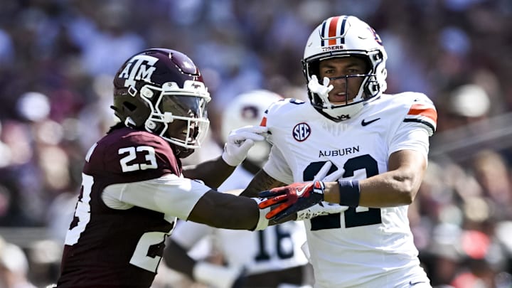 Sep 27, 2025; College Station, Texas, USA; Texas A&M Aggies running back Jamarion Morrow (23) runs a route as Auburn Tigers cornerback Donovan Starr (22) defends in coverage during the first half at Kyle Field. Mandatory Credit: Maria Lysaker-Imagn Images 