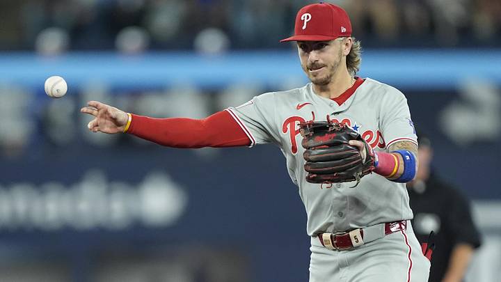 Jun 9, 2026; Toronto, Ontario, CAN; Philadelphia Phillies second baseman Bryson Stott (5) throws out Toronto Blue Jays first baseman Charles McAdoo (not pictured) at first base during the fifth inning at Rogers Centre.
