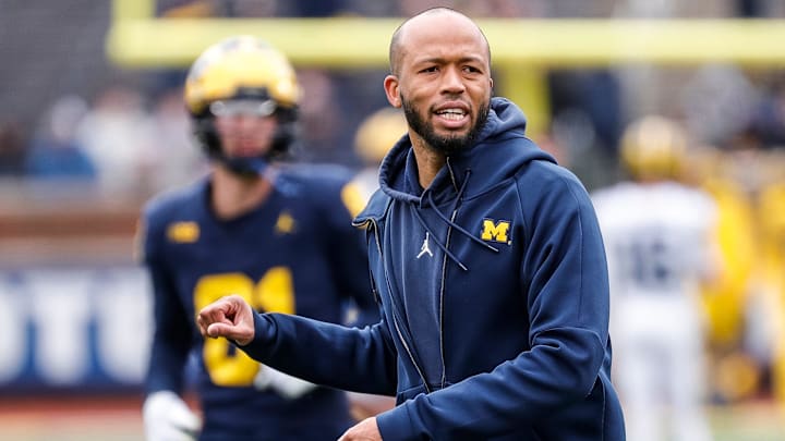 Michigan defensive pass game coordinator and defensive back coach LaMar Morgan talks to players at warmup during the spring game at Michigan Stadium in Ann Arbor on Saturday, April 20, 2024.
