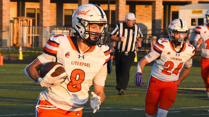 Sophomore Dalton Loguidice (8) runs the ball for the Liverpool Legends in a game against Corning on Sept. 12.