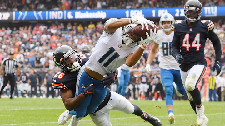 Wide receiver Kalif Raymond scores a touchdown against the Bears at Soldier Field.