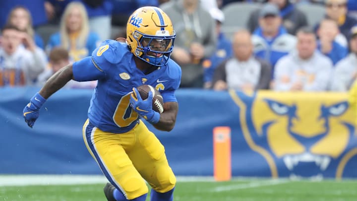 Nov 15, 2025; Pittsburgh, Pennsylvania, USA;  Pittsburgh Panthers running back Desmond Reid (0) runs after catch against the Notre Dame Fighting Irish during the first quarter at Acrisure Stadium. Mandatory Credit: Charles LeClaire-Imagn Images