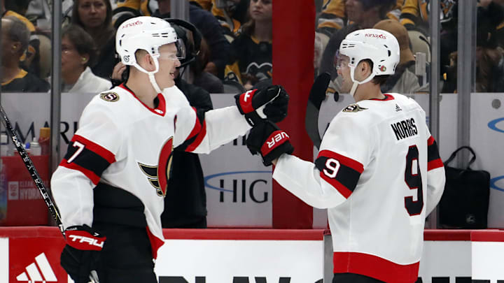 Oct 28, 2023; Pittsburgh, Pennsylvania, USA; Ottawa Senators left wing Brady Tkachuk (7) is congratulated by center Josh Norris (9) after Tkachuk scored a goal against the Pittsburgh Penguins during the first period at PPG Paints Arena. Mandatory Credit: Charles LeClaire-Imagn Images