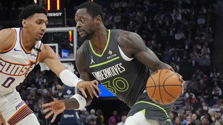 Minnesota Timberwolves forward Julius Randle works past Phoenix Suns guard Ryan Dunn in the first quarter at Target Center in Minneapolis on March 28, 2025.