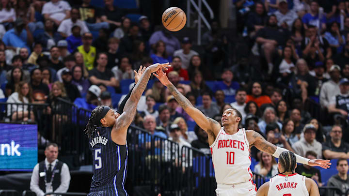 Orlando Magic forward Paolo Banchero (5) shoots a three point basket against Houston Rockets forward Jabari Smith Jr. (10) during the second half at Kia Center.
