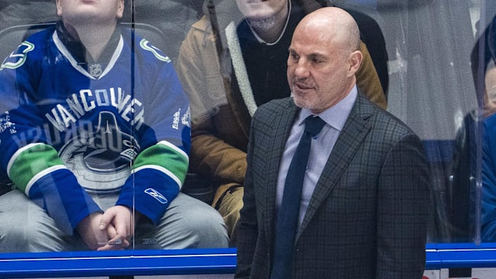 Feb 4, 2025; Vancouver, British Columbia, CAN;  Vancouver Canucks head coach Rick Tocchet on the bench against the Colorado Avalanche in the first period at Rogers Arena. Mandatory Credit: Bob Frid-Imagn Images