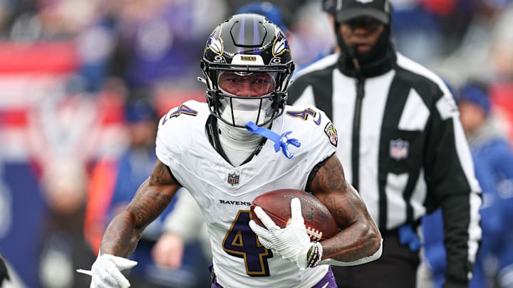 Dec 15, 2024; East Rutherford, New Jersey, USA; Baltimore Ravens wide receiver Zay Flowers (4) carries the ball against the New York Giants during the first quarter at MetLife Stadium. Mandatory Credit: Vincent Carchietta-Imagn Images Dec 15, 2024; East Rutherford, New Jersey, USA; Baltimore Ravens wide receiver Zay Flowers (4) carries the ball against the New York Giants during the first quarter at MetLife Stadium. Mandatory Credit: Vincent Carchietta-Imagn Images