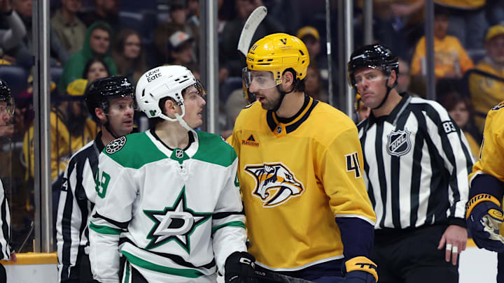 Nov 8, 2025; Nashville, Tennessee, USA; Dallas Stars center Justin Hryckowian (49) and Nashville Predators defenseman Nicolas Hague (41) exchange words as they are separated by refs during the second period at Bridgestone Arena. Mandatory Credit: Alan Poizner-Imagn Images Nov 8, 2025; Nashville, Tennessee, USA; Dallas Stars center Justin Hryckowian (49) and Nashville Predators defenseman Nicolas Hague (41) exchange words as they are separated by refs during the second period at Bridgestone Arena. Mandatory Credit: Alan Poizner-Imagn Images