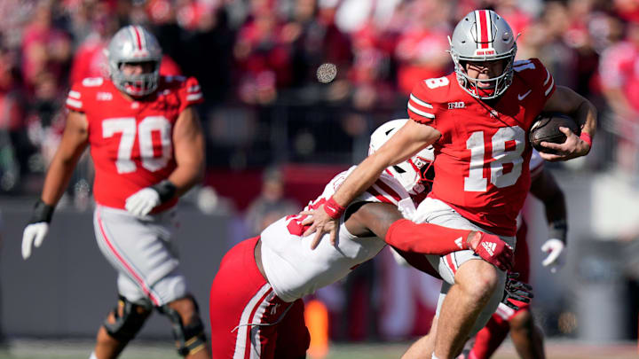 Ohio State Buckeyes quarterback Will Howard runs the ball against Nebraska Cornhuskers.
