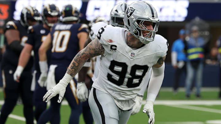 Nov 30, 2025; Inglewood, California, USA; Las Vegas Raiders defensive end Maxx Crosby (98) reacts after a tackle against the Los Angeles Chargers during the second half at SoFi Stadium. Mandatory Credit: Kiyoshi Mio-Imagn Images