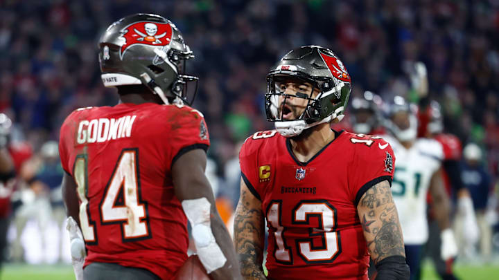 Nov 13, 2022; Munich, Germany, DEU; Tampa Bay Buccaneers wide receiver Chris Godwin (14) celebrates his touchdown with teammate wide receiver Mike Evans (13) against the Seattle Seahawks during the fourth quarter of an International Series game at Allianz Arena. Mandatory Credit: Douglas DeFelice-Imagn Images