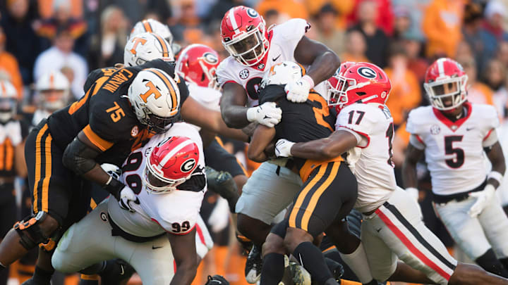 Tennessee running back Jabari Small (2) is tackled during an SEC football homecoming game between the Tennessee Volunteers and the Georgia Bulldogs