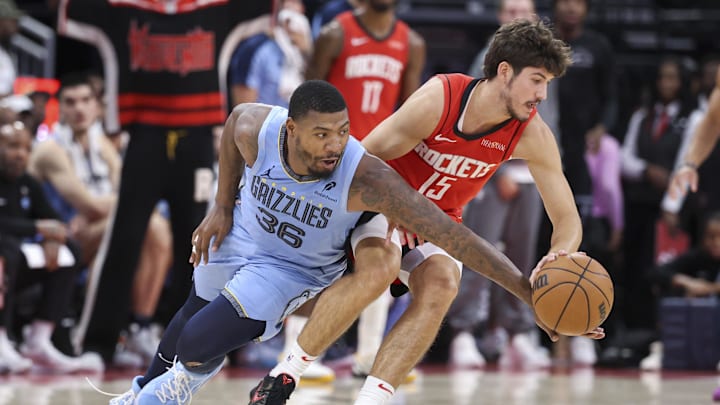 Oct 25, 2024; Houston, Texas, USA; Memphis Grizzlies guard Marcus Smart (36) defends against Houston Rockets guard Reed Sheppard (15) during the second quarter at Toyota Center. Mandatory Credit: Troy Taormina-Imagn Images Oct 25, 2024; Houston, Texas, USA; Memphis Grizzlies guard Marcus Smart (36) defends against Houston Rockets guard Reed Sheppard (15) during the second quarter at Toyota Center. Mandatory Credit: Troy Taormina-Imagn Images