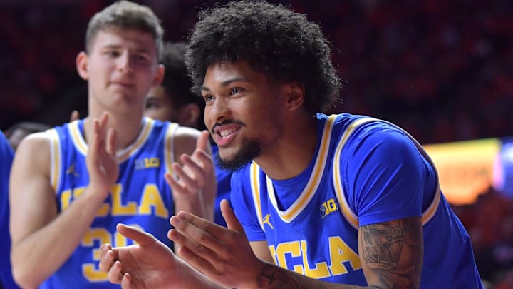Feb 11, 2025; Champaign, Illinois, USA;  UCLA Bruins guard Christian Horry (7) gives teammates a hand during the second half against the Illinois Fighting Illini at State Farm Center. Mandatory Credit: Ron Johnson-Imagn Images
