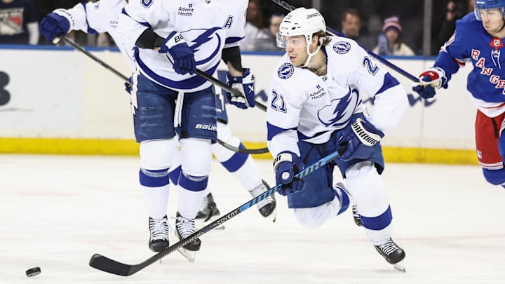 Apr 17, 2025; New York, New York, USA;  Tampa Bay Lightning center Brayden Point (21) chases the puck in the third period against the New York Rangers at Madison Square Garden. Mandatory Credit: Wendell Cruz-Imagn Images
