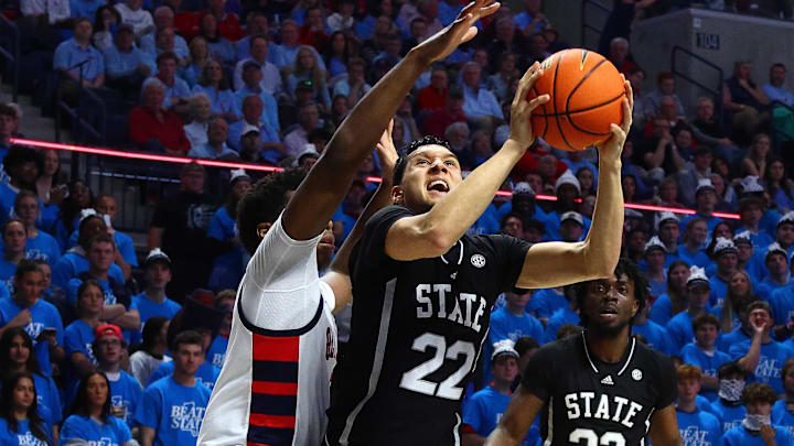 Feb 15, 2025; Oxford, Mississippi, USA; Mississippi State Bulldogs forward RJ Melendez (22) shoots as Mississippi Rebels forward Malik Dia (0) defends during the first half at The Sandy and John Black Pavilion at Ole Miss. Mandatory Credit: Petre Thomas-Imagn Images