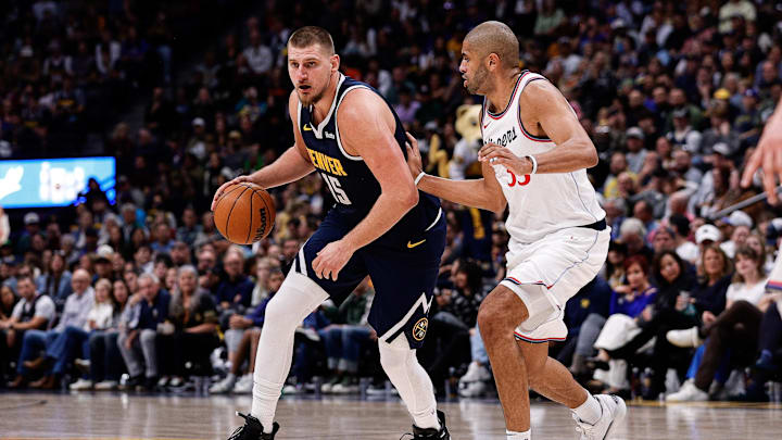 Denver Nuggets center Nikola Jokic (15) controls the ball as Los Angeles Clippers forward Nicolas Batum (33) guards in the fourth quarter at Ball Arena. Mandatory Credit: Isaiah J. Downing-Imagn Images Denver Nuggets center Nikola Jokic (15) controls the ball as Los Angeles Clippers forward Nicolas Batum (33) guards in the fourth quarter at Ball Arena. Mandatory Credit: Isaiah J. Downing-Imagn Images