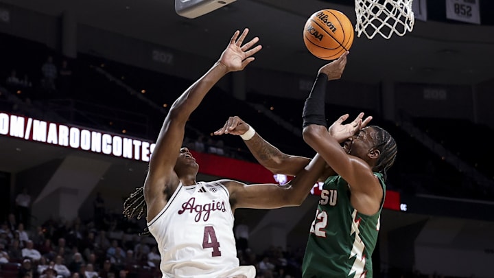 Nov 25, 2025; College Station, Texas, USA; Texas A&M Aggies forward Jamie Vinson (4) is fouled Mississippi Valley State Delta Devils forward Daniel Mayfield (22) during the first half at Reed Arena. Mandatory Credit: Maria Lysaker-Imagn Images 