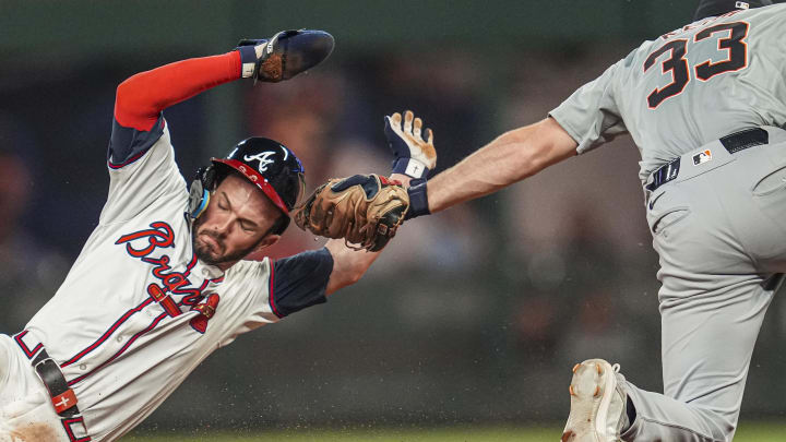 Jun 17, 2024; Cumberland, Georgia, USA; Atlanta Braves left fielder Forrest Wall (37) is tagged out by Detroit Tigers second baseman Colt Keith (33) while trying to steal second base during the seventh inning at Truist Park. Mandatory Credit: Dale Zanine-USA TODAY Sports