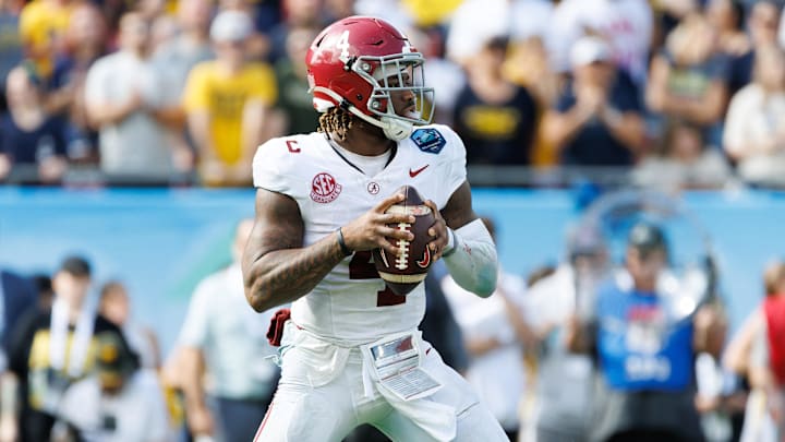 Dec 31, 2024; Tampa, FL, USA; Alabama Crimson Tide quarterback Jalen Milroe (4) looks to throw against the Michigan Wolverines during the second half at Raymond James Stadium. Mandatory Credit: Matt Pendleton-Imagn Images