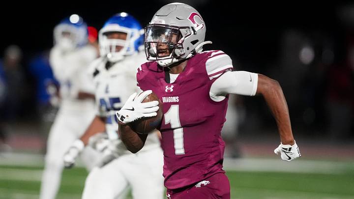 Collierville's Tae Walden Jr (1) returns a kickoff for a touchdown during the second round Class 6A playoff game.