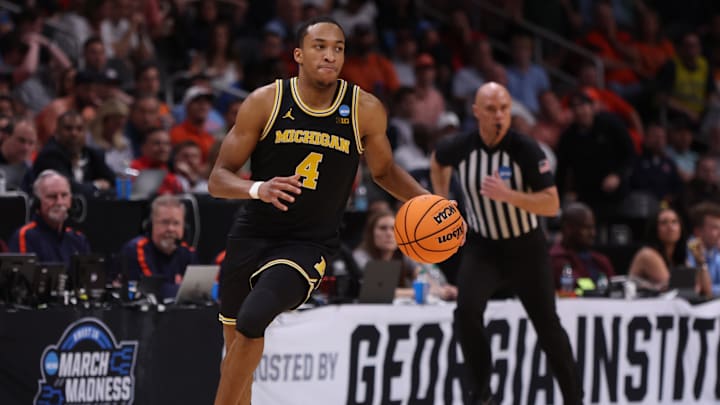 Mar 28, 2025; Atlanta, GA, USA; Michigan Wolverines guard Nimari Burnett (4) dribbles in the second half of a South Regional semifinal of the 2025 NCAA tournament against the Auburn Tigers at State Farm Arena. Mandatory Credit: Brett Davis-Imagn Images