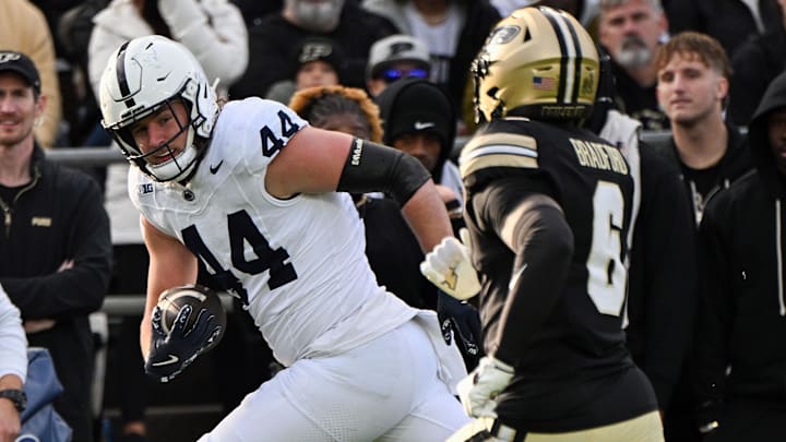 Penn State Nittany Lions tight end Tyler Warren is defended by Purdue Boilermakers defensive back Smiley Bradford during the first quarter at Ross-Ade Stadium.