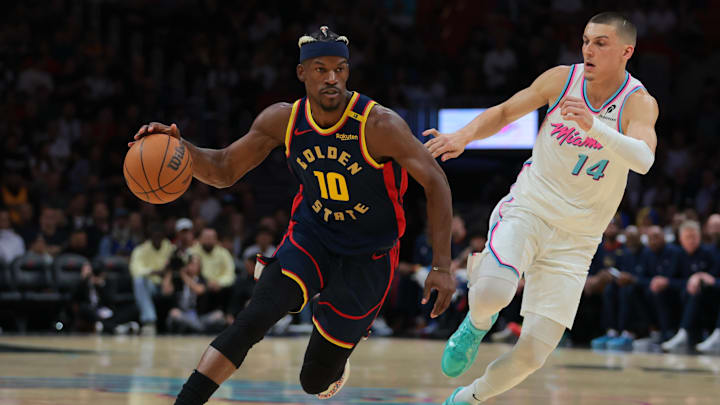 Mar 25, 2025; Miami, Florida, USA; Golden State Warriors forward Jimmy Butler III (10) drives to the basket past Miami Heat guard Tyler Herro (14) during the first quarter at Kaseya Center. Mandatory Credit: Sam Navarro-Imagn Images Mar 25, 2025; Miami, Florida, USA; Golden State Warriors forward Jimmy Butler III (10) drives to the basket past Miami Heat guard Tyler Herro (14) during the first quarter at Kaseya Center. Mandatory Credit: Sam Navarro-Imagn Images