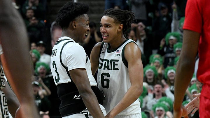 Mar 5, 2026; East Lansing, Michigan, USA;  Michigan State Spartans forward Cameron Ward (3) cheers forward Jordan Scott (6) against Rutgers Scarlet Knights during the second half at Jack Breslin Student Events Center. Mandatory Credit: Dale Young-Imagn Images