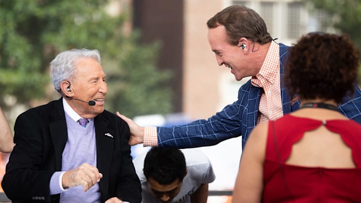 Peyton Manning greets Lee Corso during ESPN's College GameDay show held outside of Ayres Hall on the University of Tennessee campus in Knoxville, Tenn. on Saturday, Oct. 15, 2022. The college football pregame show returned to Knoxville for the second time this season for No. 8 Tennessee's SEC rivalry game against No. 1 Alabama. Peyton Manning greets Lee Corso during ESPN's College GameDay show held outside of Ayres Hall on the University of Tennessee campus in Knoxville, Tenn. on Saturday, Oct. 15, 2022. The college football pregame show returned to Knoxville for the second time this season for No. 8 Tennessee's SEC rivalry game against No. 1 Alabama.