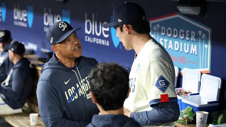 May 30, 2026; Los Angeles, California, USA;Los Angeles Dodgers pitcher Roki Sasaki (right) is greeted in the dugout by manager Dave Roberts (left) after leaving the game during the sixth inning against the Philadelphia Phillies at Dodger Stadium. Mandatory Credit: Kiyoshi Mio-Imagn Images