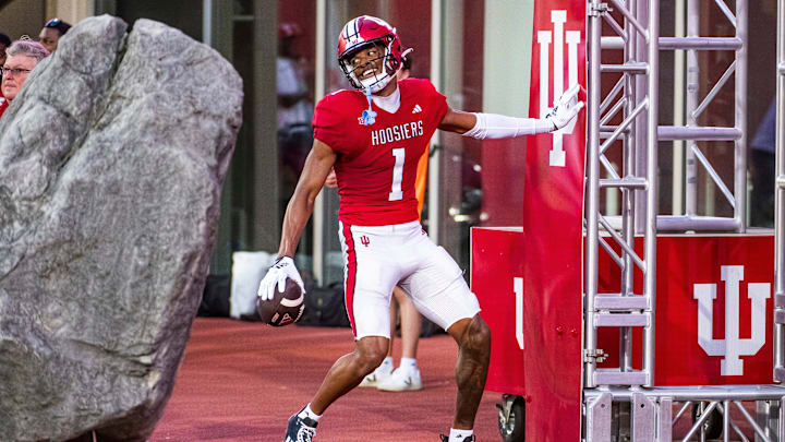 Indiana's Donaven McCulley (1) smiles after scoring a touchdown during the Indiana football spring game at Memorial Stadaium on Thursday, April 18, 2024.