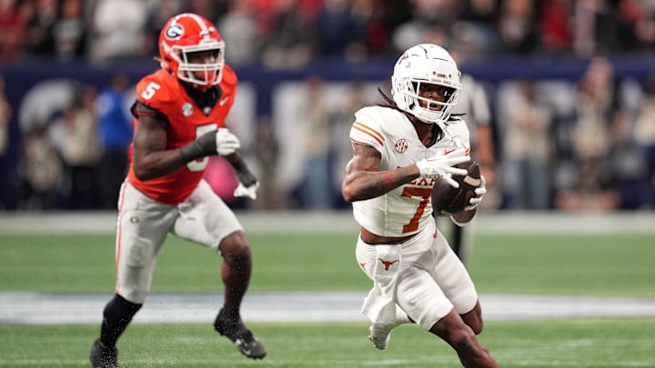 Dec 7, 2024; Atlanta, GA, USA; Texas Longhorns wide receiver Isaiah Bond (7) makes a catch past Georgia Bulldogs linebacker Raylen Wilson (5) during the first half in the 2024 SEC Championship game at Mercedes-Benz Stadium. Mandatory Credit: Dale Zanine-Imagn Images