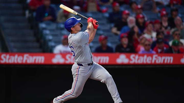Sep 27, 2024; Anaheim, California, USA; Texas Rangers center fielder Wyatt Langford (36) hits a two run home run against the Los Angeles Angels during the first inning at Angel Stadium.
