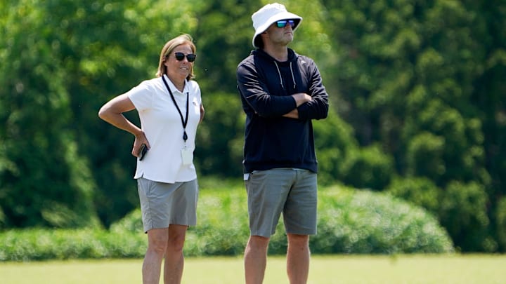 Katie Blackburn, left, and Duke Tobin, right, watch the Cincinnati Bengals practice, Wednesday, June 11, 2025, at Kettering Health Practice Fields in Downtown Cincinnati.
