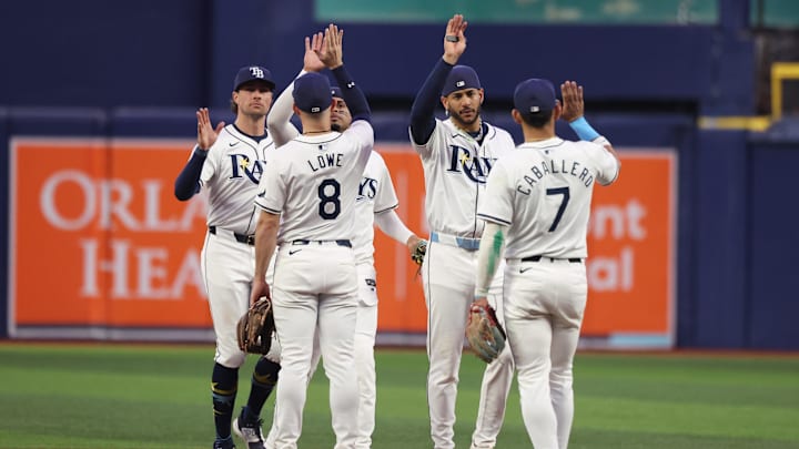 Sep 17, 2024; St. Petersburg, Florida, USA; Tampa Bay Rays shortstop Jose Caballero (7), outfielder Jose Siri (22), second base Brandon Lowe (8), left fielder Christopher Morel (24) and outfielder Josh Lowe (15) celebrate beating the Boston Red Sox at Tropicana Field. Mandatory Credit: Kim Klement Neitzel-Imagn Images Sep 17, 2024; St. Petersburg, Florida, USA; Tampa Bay Rays shortstop Jose Caballero (7), outfielder Jose Siri (22), second base Brandon Lowe (8), left fielder Christopher Morel (24) and outfielder Josh Lowe (15) celebrate beating the Boston Red Sox at Tropicana Field. Mandatory Credit: Kim Klement Neitzel-Imagn Images