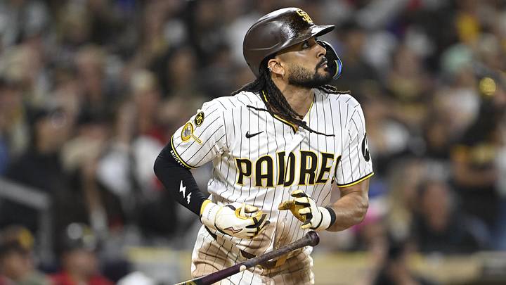 Jun 23, 2026; San Diego, California, USA; San Diego Padres right fielder Fernando Tatis Jr. (23) hits a solo home run during the seventh inning against the Atlanta Braves at Petco Park. Mandatory Credit: Denis Poroy-Imagn Images