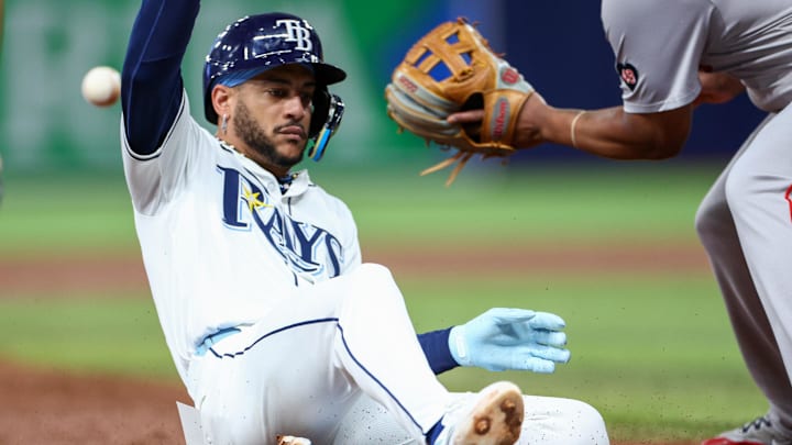 Sep 19, 2024; St. Petersburg, Florida, USA; Tampa Bay Rays outfielder Jose Siri (22) slides into third base against the Boston Red Sox in the third inning at Tropicana Field. Mandatory Credit: Nathan Ray Seebeck-Imagn Images Sep 19, 2024; St. Petersburg, Florida, USA; Tampa Bay Rays outfielder Jose Siri (22) slides into third base against the Boston Red Sox in the third inning at Tropicana Field. Mandatory Credit: Nathan Ray Seebeck-Imagn Images