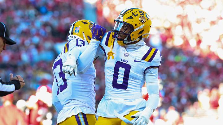 LSU Tigers defensive back A.J. Haulcy (13) and Louisiana State Tigers safety Tamarcus Cooley (0) react during the first half against the Oklahoma Sooners at Gaylord Family-Oklahoma Memorial Stadium. LSU Tigers defensive back A.J. Haulcy (13) and Louisiana State Tigers safety Tamarcus Cooley (0) react during the first half against the Oklahoma Sooners at Gaylord Family-Oklahoma Memorial Stadium.