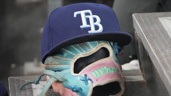 Sep 26, 2025; Toronto, Ontario, CAN; The hat and glove of Tampa Bay Rays third baseman Junior Caminero (13) in the dugout during the game against the Toronto Blue Jays at Rogers Centre. Sep 26, 2025; Toronto, Ontario, CAN; The hat and glove of Tampa Bay Rays third baseman Junior Caminero (13) in the dugout during the game against the Toronto Blue Jays at Rogers Centre.