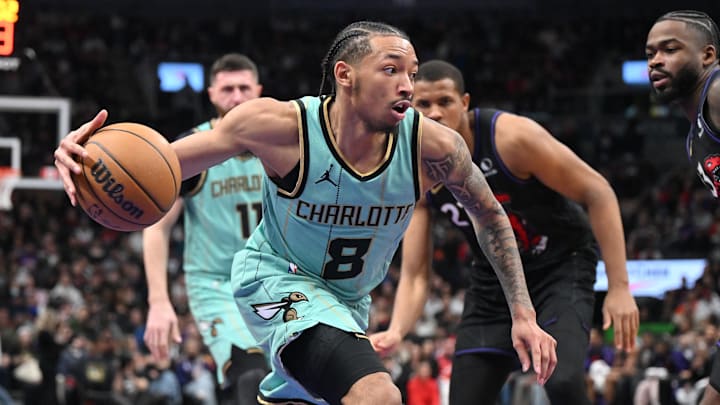 Mar 28, 2025; Toronto, Ontario, CAN; Charlotte Hornets guard Nick Smith Jr. (8) drives to the basket against the Toronto Raptors in the second half at Scotiabank Arena. Mandatory Credit: Dan Hamilton-Imagn Images