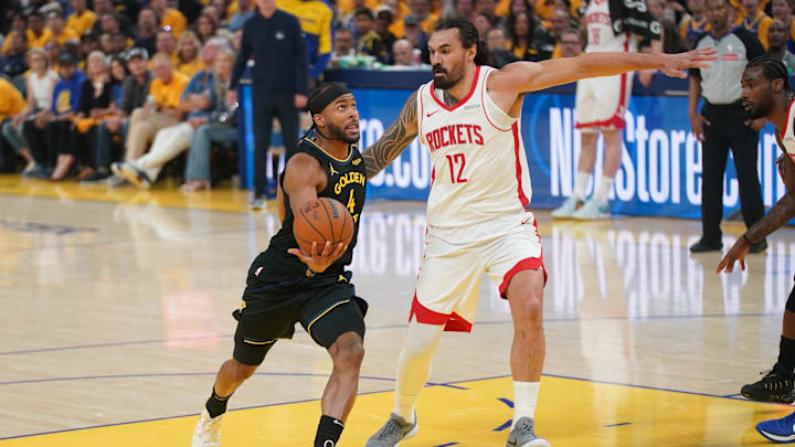 May 2, 2025; San Francisco, California, USA; Golden State Warriors guard Moses Moody (4) drives past Houston Rockets center Steven Adams (12) in the first quarter of game six of the first round for the 2025 NBA Playoffs at Chase Center. Mandatory Credit: Cary Edmondson-Imagn Images